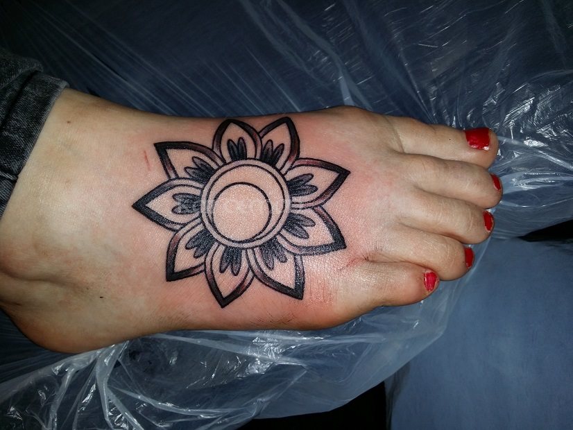 Foot flower tattoo